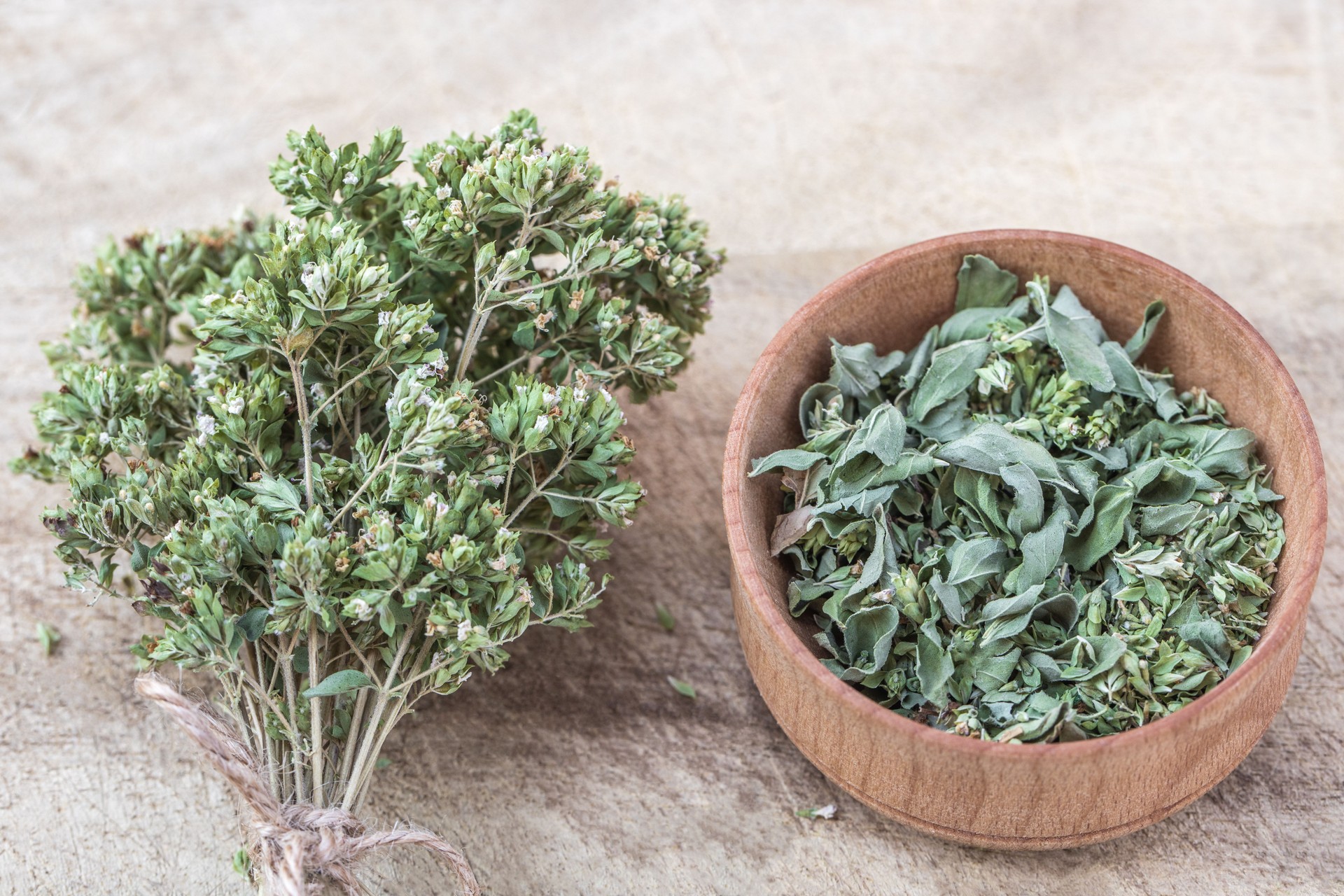 Dried marjoram or oregano on a wooden background, spice, herb, organic food